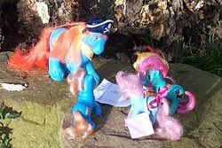 The ponies and Barnacle look at the map